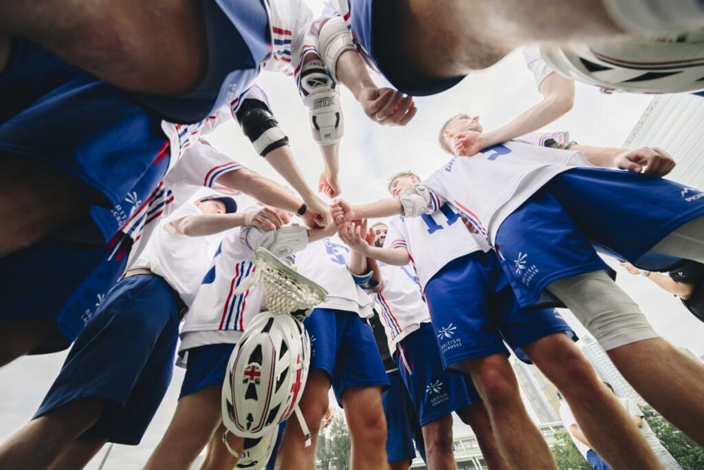 Low down shot of Lacrosse team getting ready to play